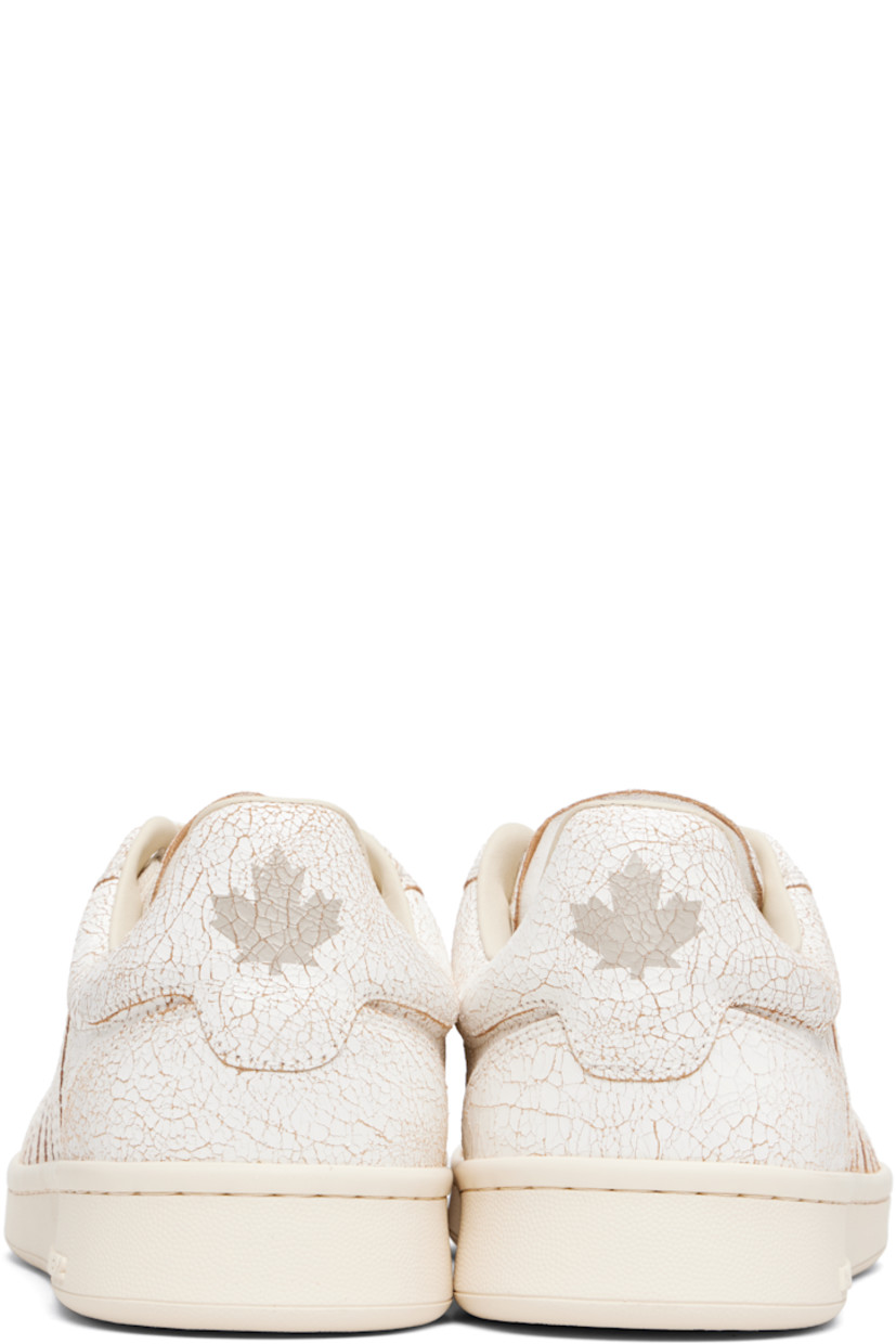 Low-top cracked leather sneakers.

· Lace-up closure
· Logo printed at padded tongue 
· Padded collar
· Text embroidered at outer side
· Graphic printed at heel tab
· Terrycloth lining
· Treaded rubber sole

Supplier color: Vintage white