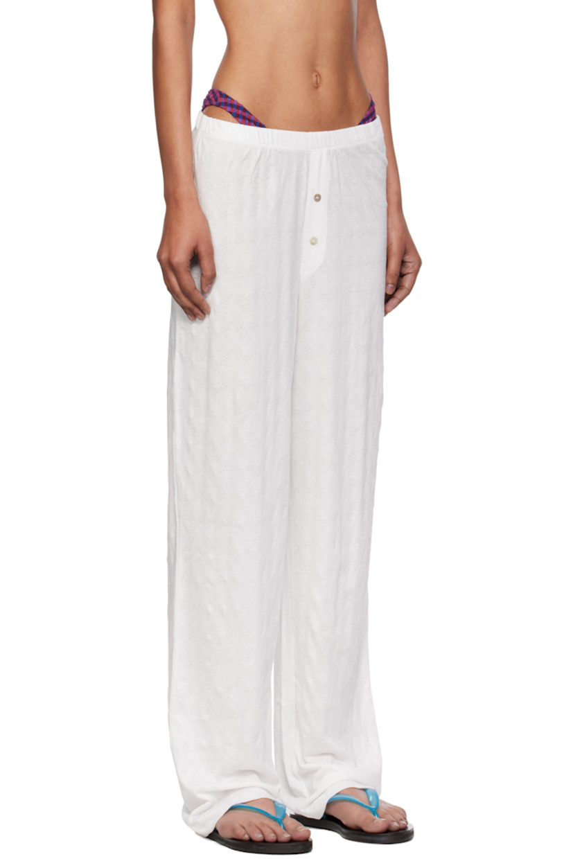 Stretch cotton pointelle lounge pants.

· Elasticized waistband
· Button hardware at mock fly 

Supplier color: White