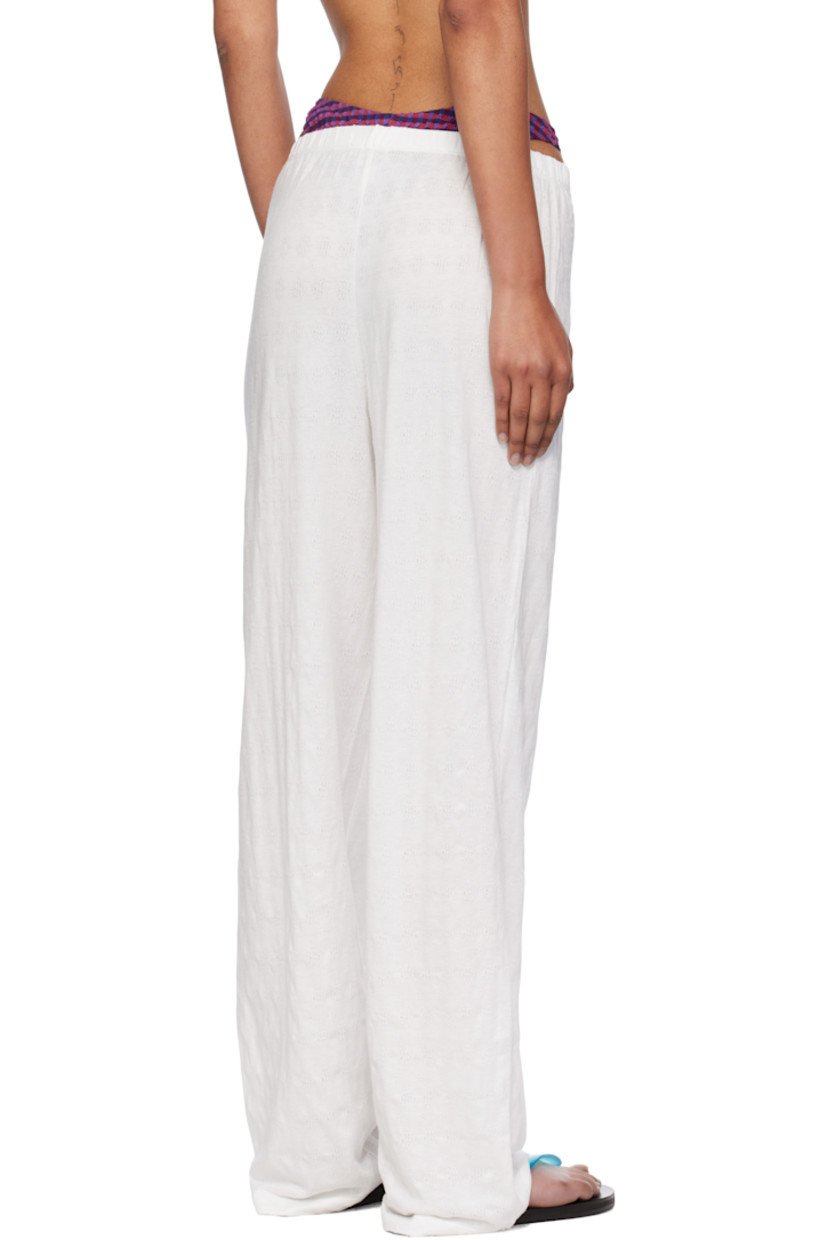 Stretch cotton pointelle lounge pants.

· Elasticized waistband
· Button hardware at mock fly 

Supplier color: White
