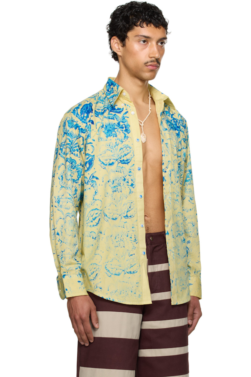 Cotton-blend twill shirt. Floral pattern printed throughout.

· Spread collar
· Button closure
· Patch pocket
· Shirttail hem
· Adjustable buttoned barrel cuffs
· Box pleat at back yoke

Part of the exclusive SSENSE HEAT capsule.

Supplier color: Yellow/Blue