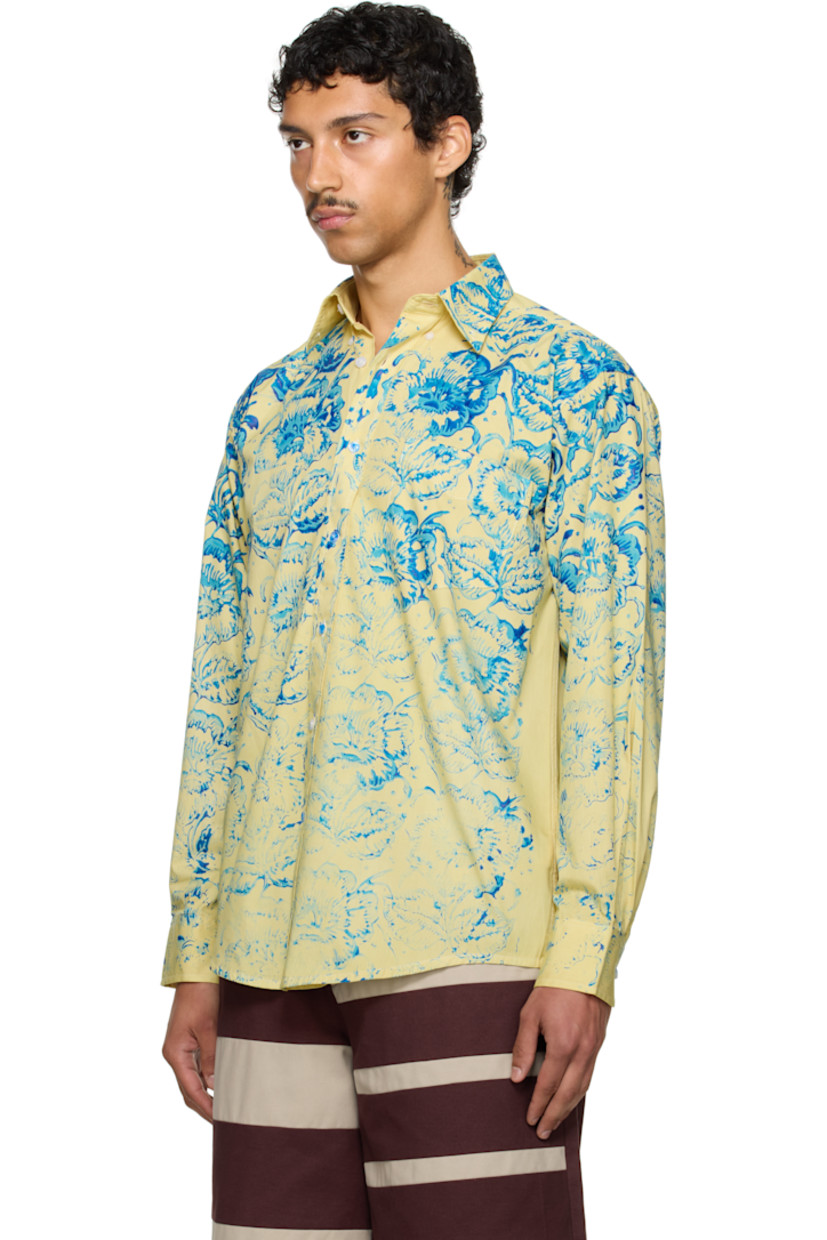 Cotton-blend twill shirt. Floral pattern printed throughout.

· Spread collar
· Button closure
· Patch pocket
· Shirttail hem
· Adjustable buttoned barrel cuffs
· Box pleat at back yoke

Part of the exclusive SSENSE HEAT capsule.

Supplier color: Yellow/Blue