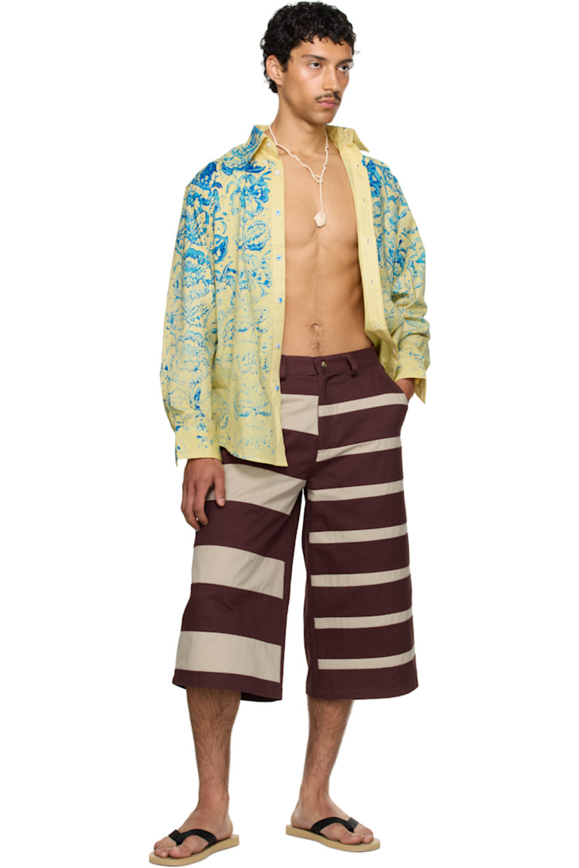 Cotton-blend twill shirt. Floral pattern printed throughout.

· Spread collar
· Button closure
· Patch pocket
· Shirttail hem
· Adjustable buttoned barrel cuffs
· Box pleat at back yoke

Part of the exclusive SSENSE HEAT capsule.

Supplier color: Yellow/Blue