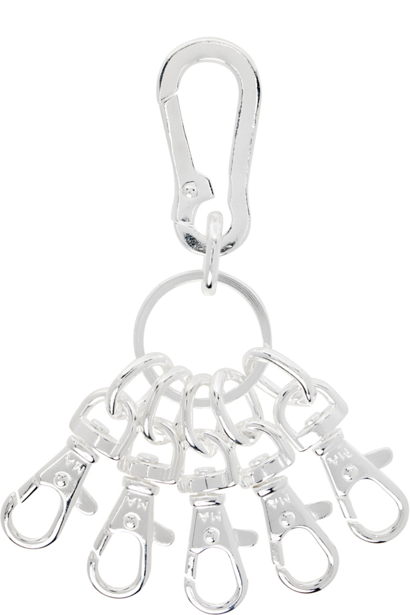 Keychain in sterling silver. 

· Keyring and lanyard-clasp fastening at top
· Logo-engraved lobster clasps at drop 
· H4.5"x W3.5"

Supplier color: Silver