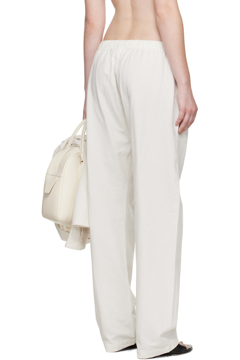Cotton broadcloth lounge pants.

· Drawstring at elasticized waistband 
· Two-pocket styling
· Rubber logo patch at front waist

Supplier color: Cloud white