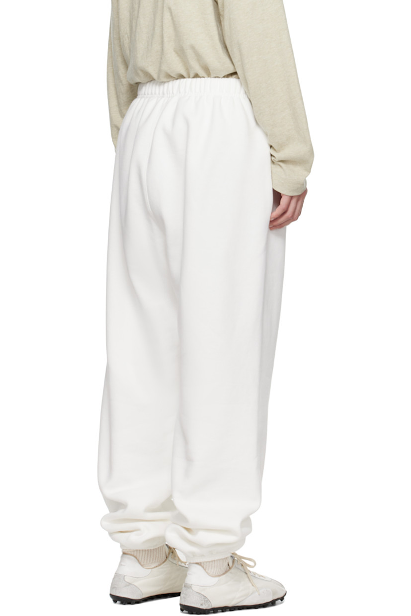 Cotton-blend fleece sweatpants.

· Drawstring at elasticized waistband
· Two-pocket styling
· Logo patch at front
· Reflective logo bonded at leg
· Elasticized cuffs

Supplier color: Cloud white