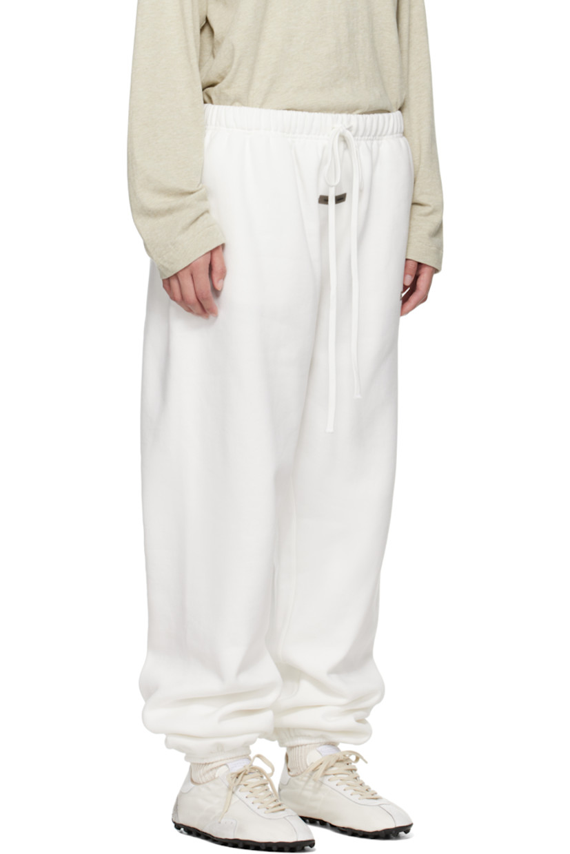Cotton-blend fleece sweatpants.

· Drawstring at elasticized waistband
· Two-pocket styling
· Logo patch at front
· Reflective logo bonded at leg
· Elasticized cuffs

Supplier color: Cloud white