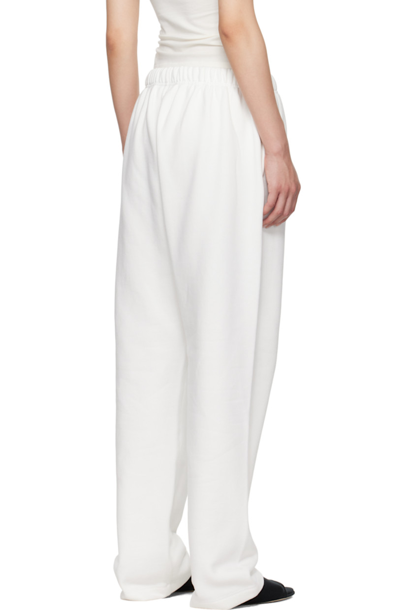 Loose-fit cotton-blend fleece sweatpants.

· Drawstring at elasticized waistband
· Two-pocket styling
· Logo patch at front
· Reflective logo bonded at leg
· Dropped inseam

Supplier color: Cloud white