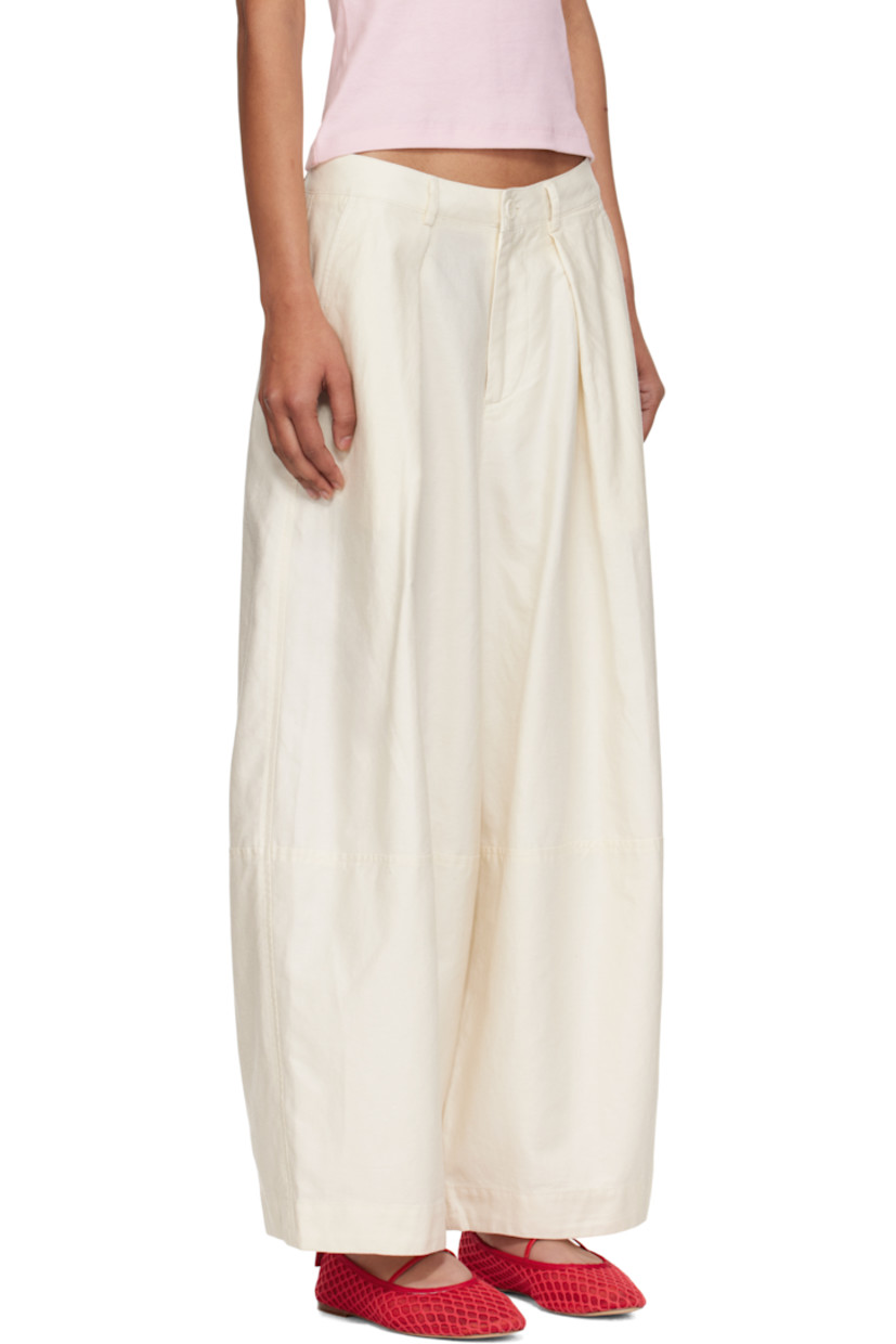 Garment-dyed cotton- and linen-blend twill trousers.

· Paneled construction
· Wide-leg
· High-rise
· Belt loops
· Three-pocket styling
· Zip fly
· Pleats at front
· Corozo hardware

Supplier color: Off white