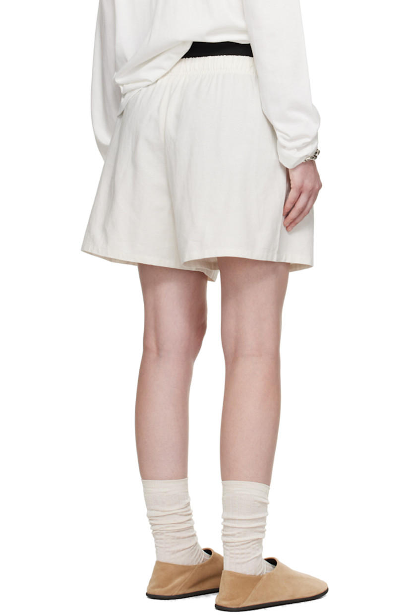 Cotton broadcloth shorts.

· Drawstring at elasticized waistband 
· Two-pocket styling
· Rubber logo patch at front

Supplier color: Cloud white