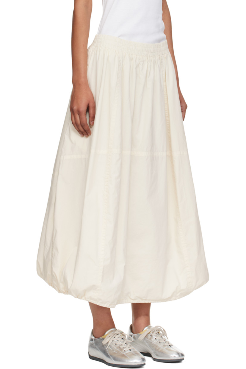 Lightweight cotton poplin midi skirt.

· Garment-dyed and enzyme-washed
· Paneled construction
· Concealed drawstring at elasticized waistband
· Two-pocket styling
· Bungee-style drawstring at balloon hem
· Fully lined

Supplier color: Off white