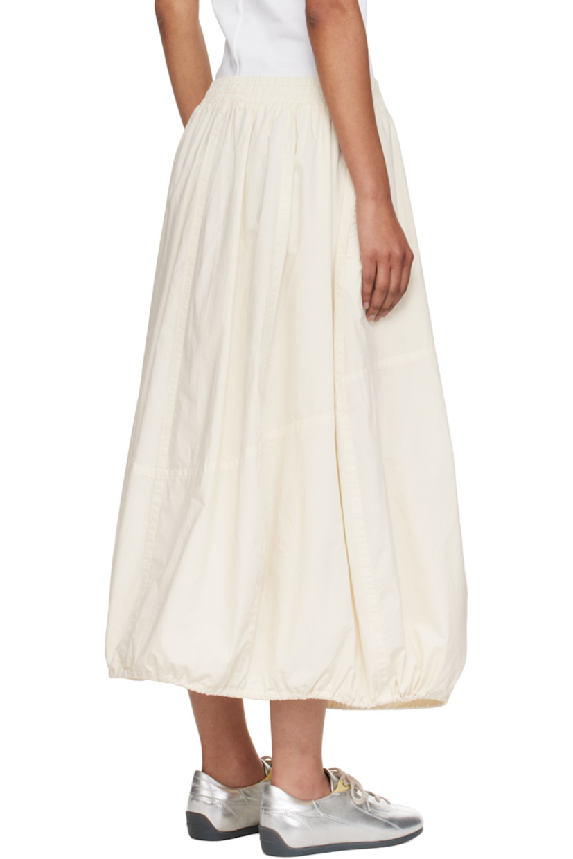 Lightweight cotton poplin midi skirt.

· Garment-dyed and enzyme-washed
· Paneled construction
· Concealed drawstring at elasticized waistband
· Two-pocket styling
· Bungee-style drawstring at balloon hem
· Fully lined

Supplier color: Off white