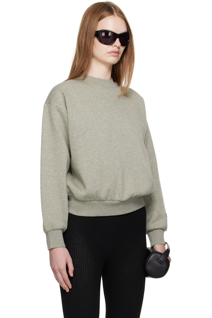 Cotton-blend fleece sweatshirt. 

· Rib-knit crewneck, hem, and cuffs
· Dropped shoulders
· Rubber logo patch at cuff and back collar 
· Bonded logo at back 

Supplier color: Concrete heather