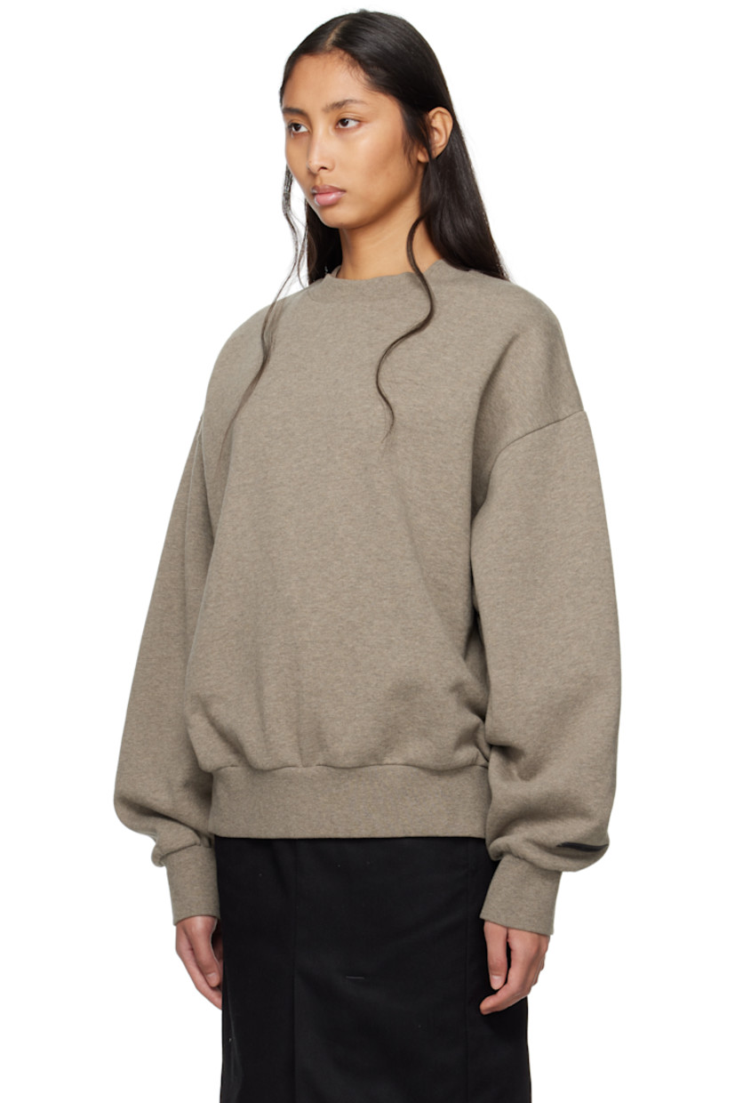 Heavyweight 380 gsm cotton-blend fleece sweatshirt. 

· Rib-knit crewneck, hem, and cuffs
· Dropped shoulders
· Rubberized logo patch at cuff
· Logo bonded at back 

Part of the Core Collection.

Supplier color: Homestead heather