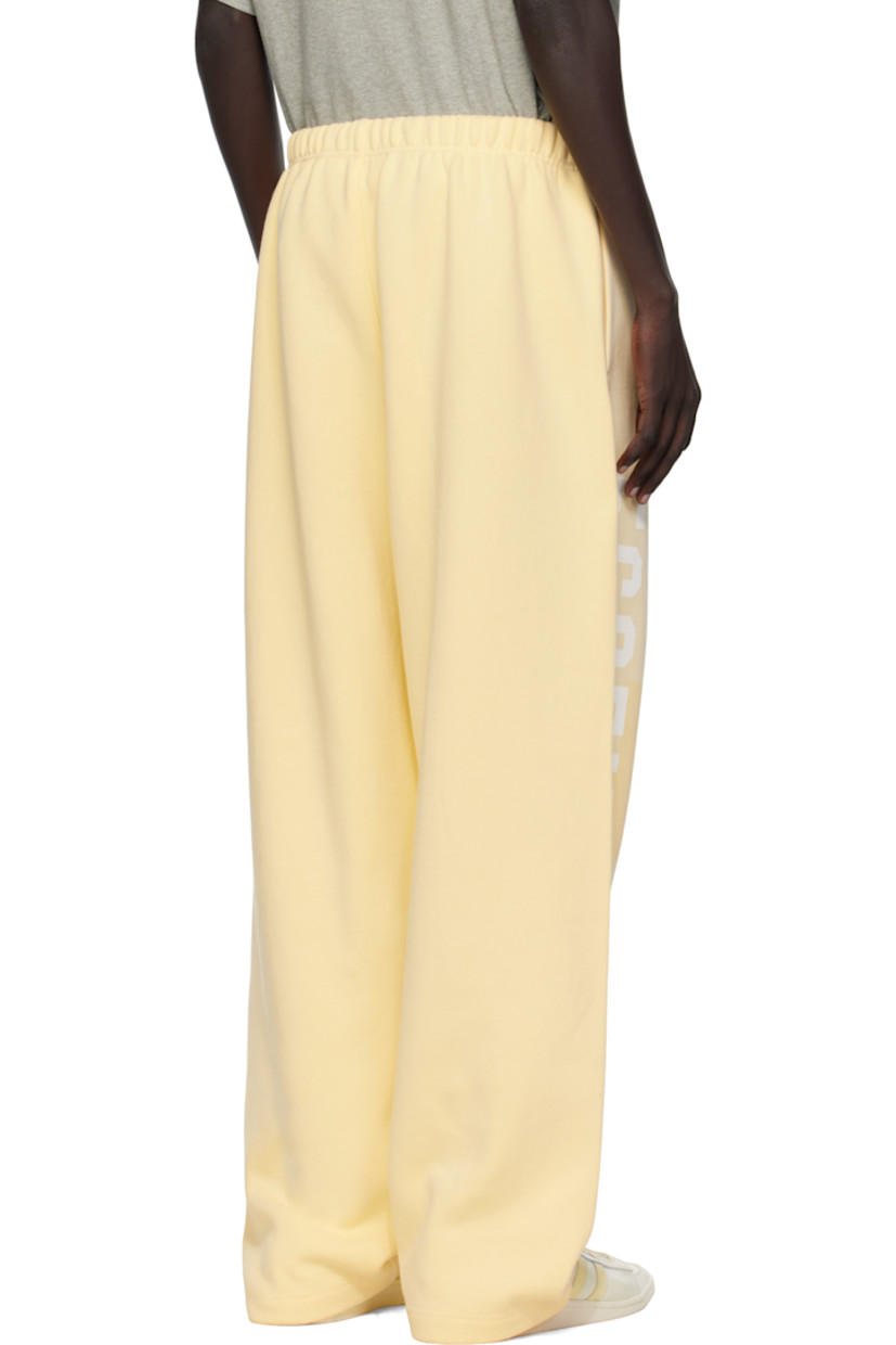 Wide-leg cotton-blend fleece sweatpants.

· Drawstring at elasticized waistband
· Two-pocket styling
· Rubber logo patch at front
· Logo printed at outseam

Supplier color: Garden yellow