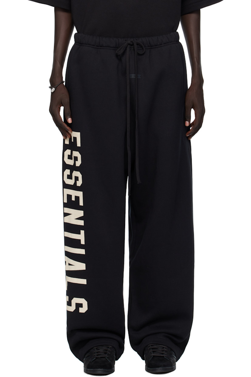 Wide-leg cotton-blend fleece sweatpants.

· Drawstring at elasticized waistband
· Two-pocket styling
· Rubber logo patch at front
· Logo printed at outseam

Supplier color: Jet black