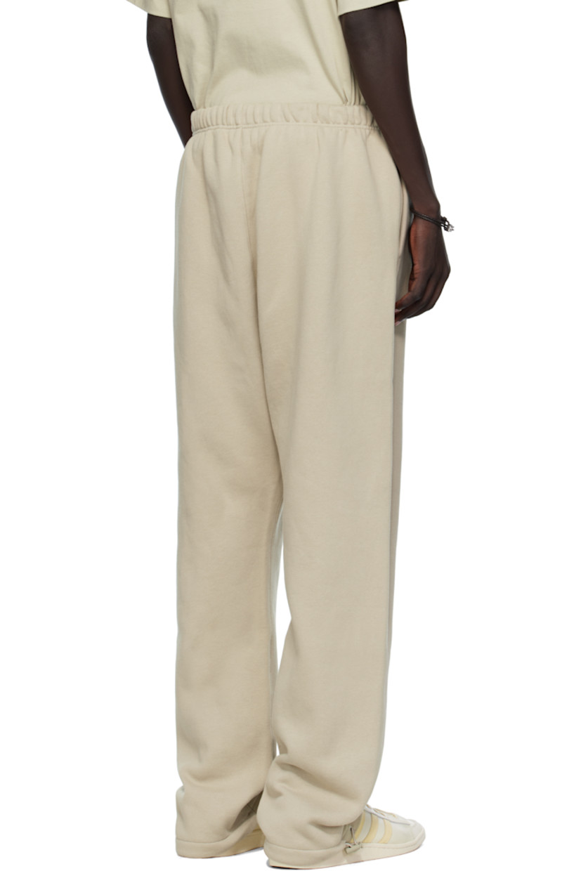 Cotton-blend fleece sweatpants.

· Drawstring at elasticized waistband
· Two-pocket styling
· Rubber logo patch at front
· Logo bonded at leg
· Bungee-style drawstring at cuffs

Supplier color: Abbey stone