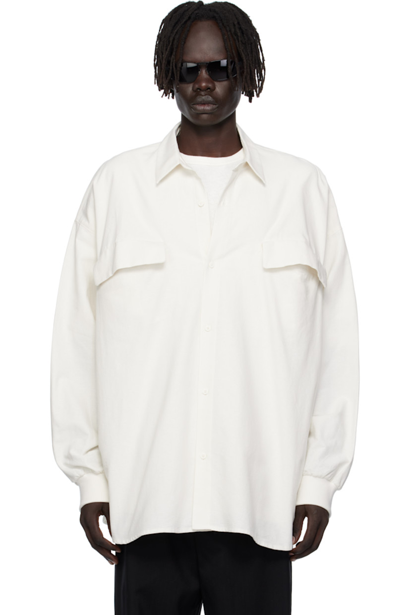 Cotton oxford cloth shirt.

· Spread collar 
· Button closure
· Flap pockets at chest
· Shirttail hem 
· Dropped shoulders
· Rib-knit cuffs
· Rubber logo patch at back collar 

Supplier color: Cloud white