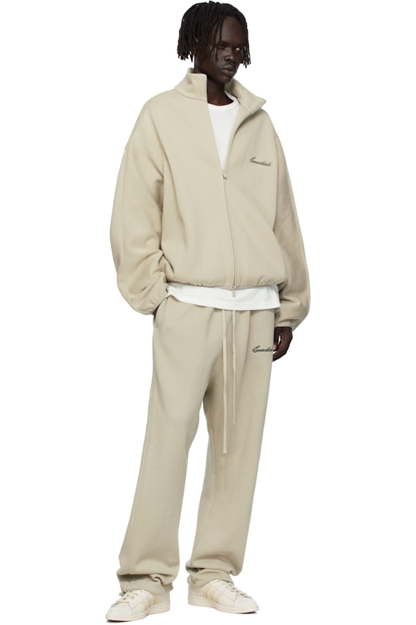 Cotton-blend fleece track jacket.

· Stand collar
· Two-way zip closure
· Logo embroidered at chest
· Seam pockets at waist
· Elasticized hem and cuffs
· Piping at sleeves
· Rubber logo patch at back collar

Supplier color: Abbey stone/Tonal piping