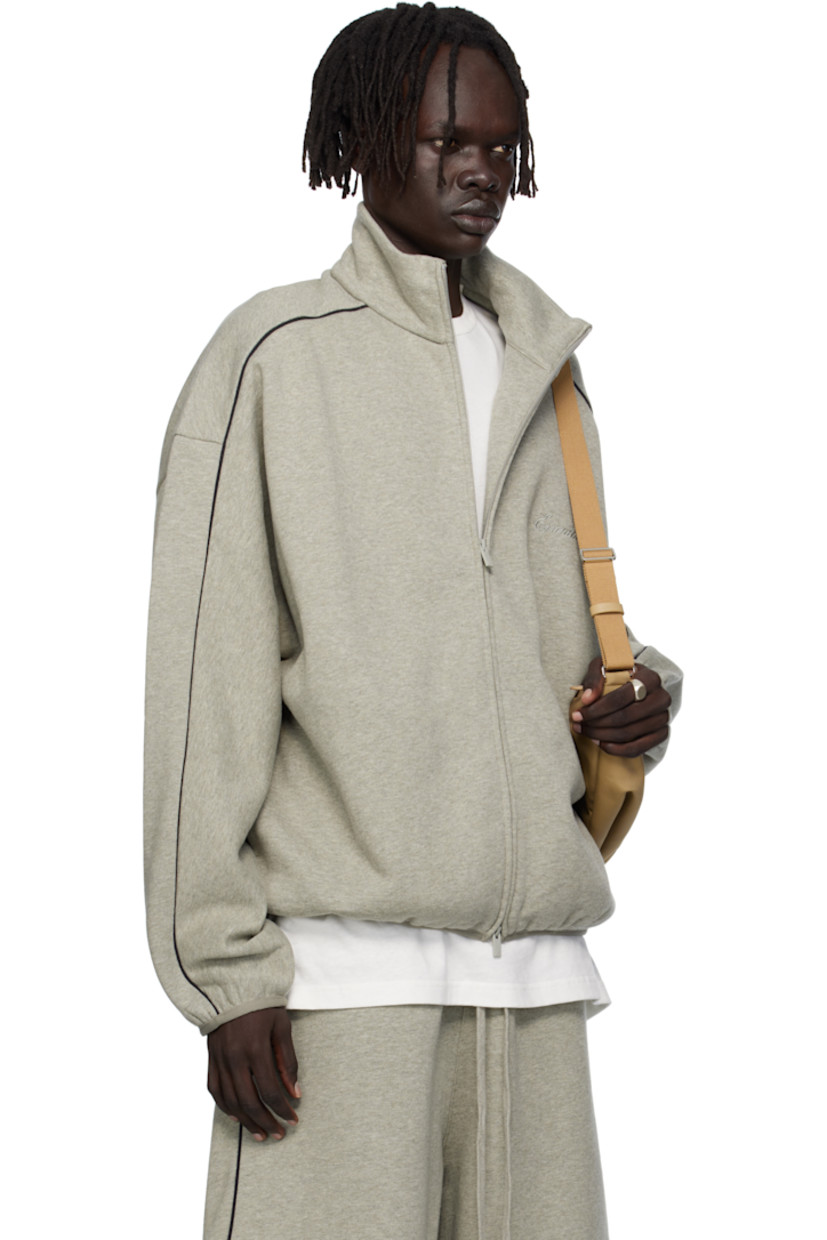 Cotton-blend fleece track jacket.

· Stand collar
· Two-way zip closure
· Logo embroidered at chest
· Seam pockets at waist
· Elasticized hem and cuffs
· Piping at sleeves
· Rubber logo patch at back collar

Supplier color: Concrete heather/Black piping