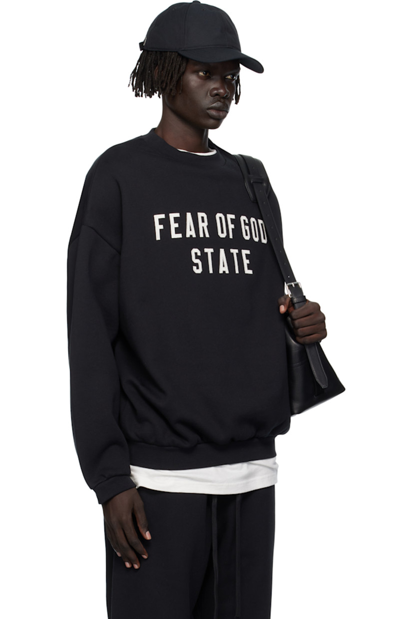 Cotton-blend fleece sweatshirt.

· Rib-knit crewneck, hem, and cuffs
· Logo appliqués at front
· Dropped shoulders
· Rubber logo patch at back collar 

Supplier color: Jet black