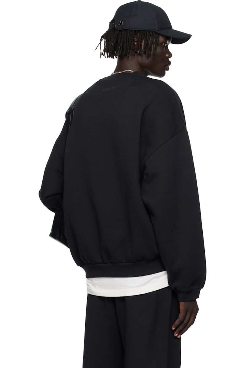 Cotton-blend fleece sweatshirt.

· Rib-knit crewneck, hem, and cuffs
· Logo appliqués at front
· Dropped shoulders
· Rubber logo patch at back collar 

Supplier color: Jet black