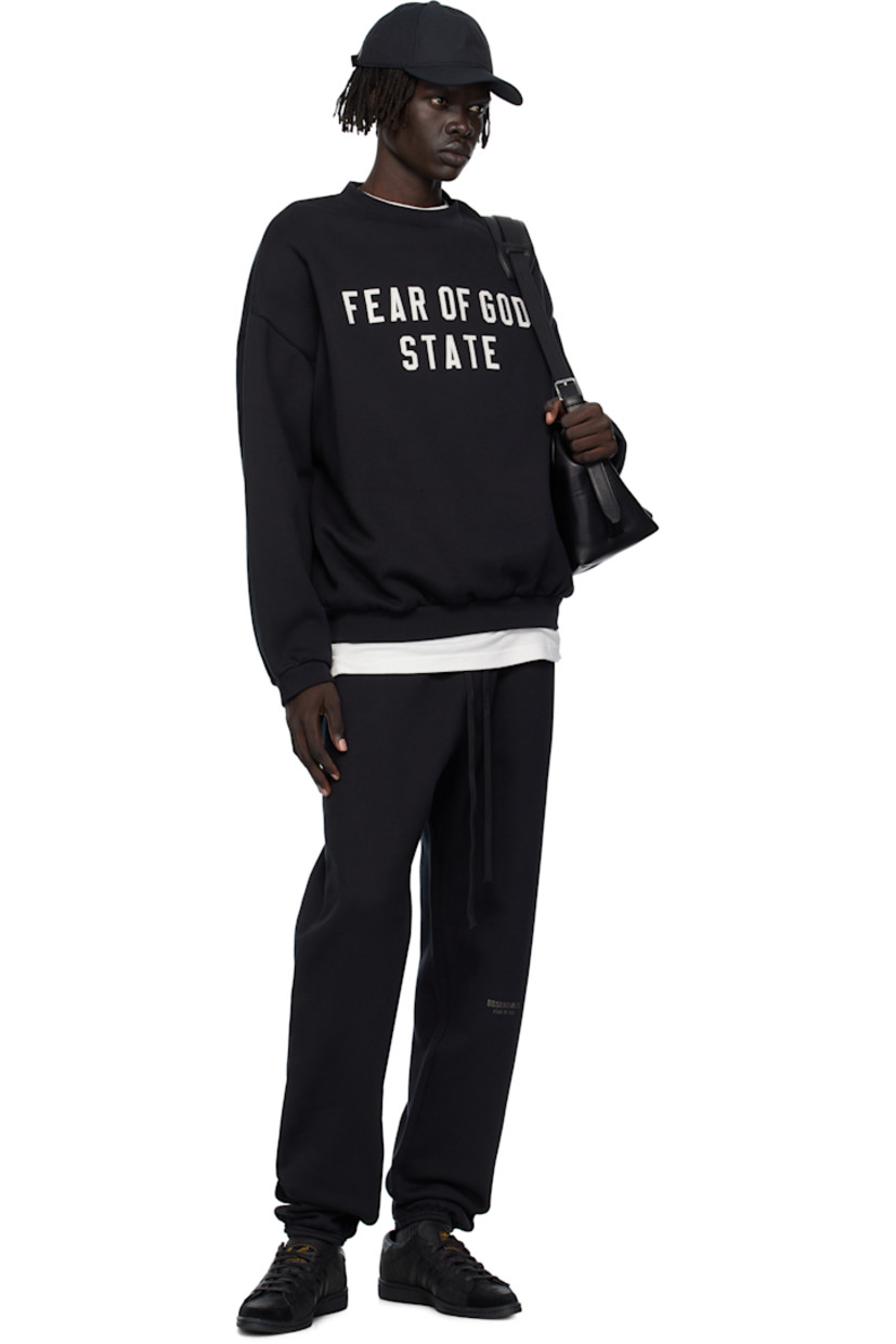 Cotton-blend fleece sweatshirt.

· Rib-knit crewneck, hem, and cuffs
· Logo appliqués at front
· Dropped shoulders
· Rubber logo patch at back collar 

Supplier color: Jet black