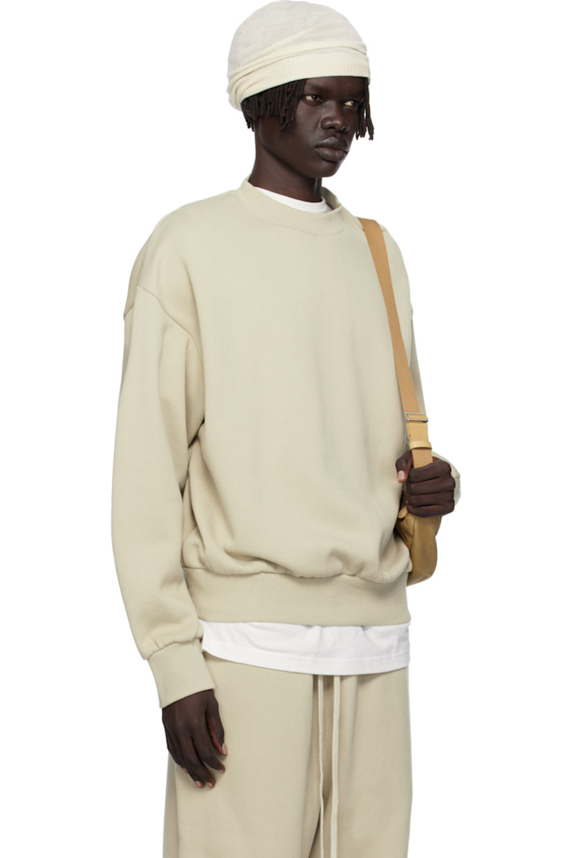 Cotton-blend fleece sweatshirt.

· Rib-knit crewneck, hem, and cuffs
· Dropped shoulders
· Rubber logo patch at cuff
· Logo bonded at back

Supplier color: Abbey stone