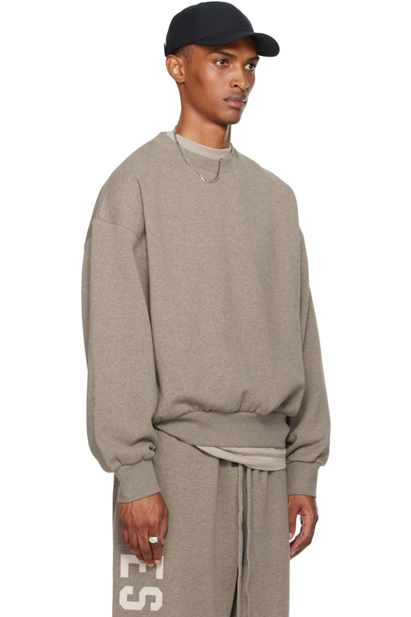 Cotton-blend fleece sweatshirt.

· Rib-knit crewneck, hem, and cuffs
· Dropped shoulders
· Logo patch at cuff
· Reflective logo bonded at back

Supplier color: Homestead heather