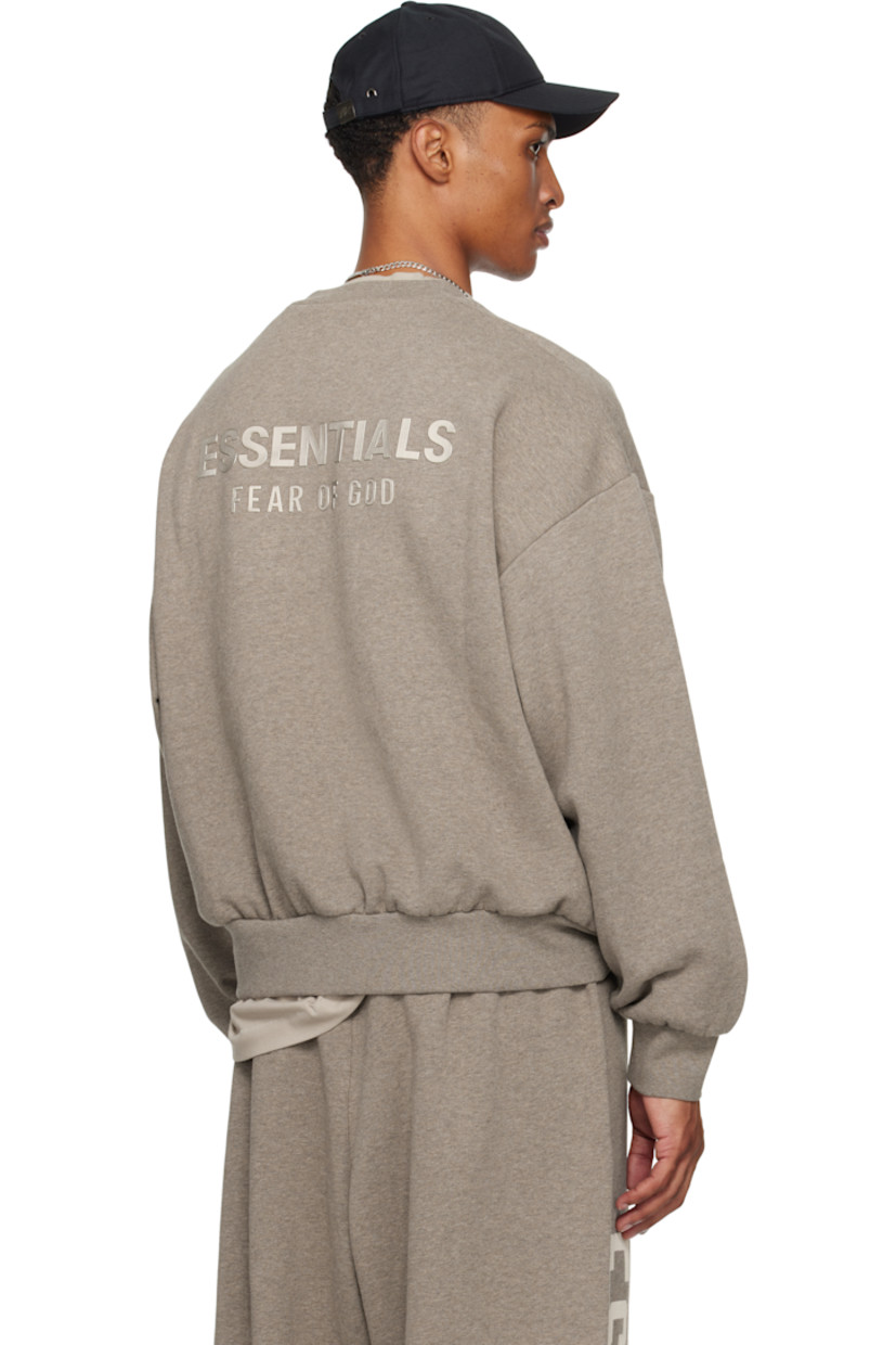 Cotton-blend fleece sweatshirt.

· Rib-knit crewneck, hem, and cuffs
· Dropped shoulders
· Logo patch at cuff
· Reflective logo bonded at back

Supplier color: Homestead heather