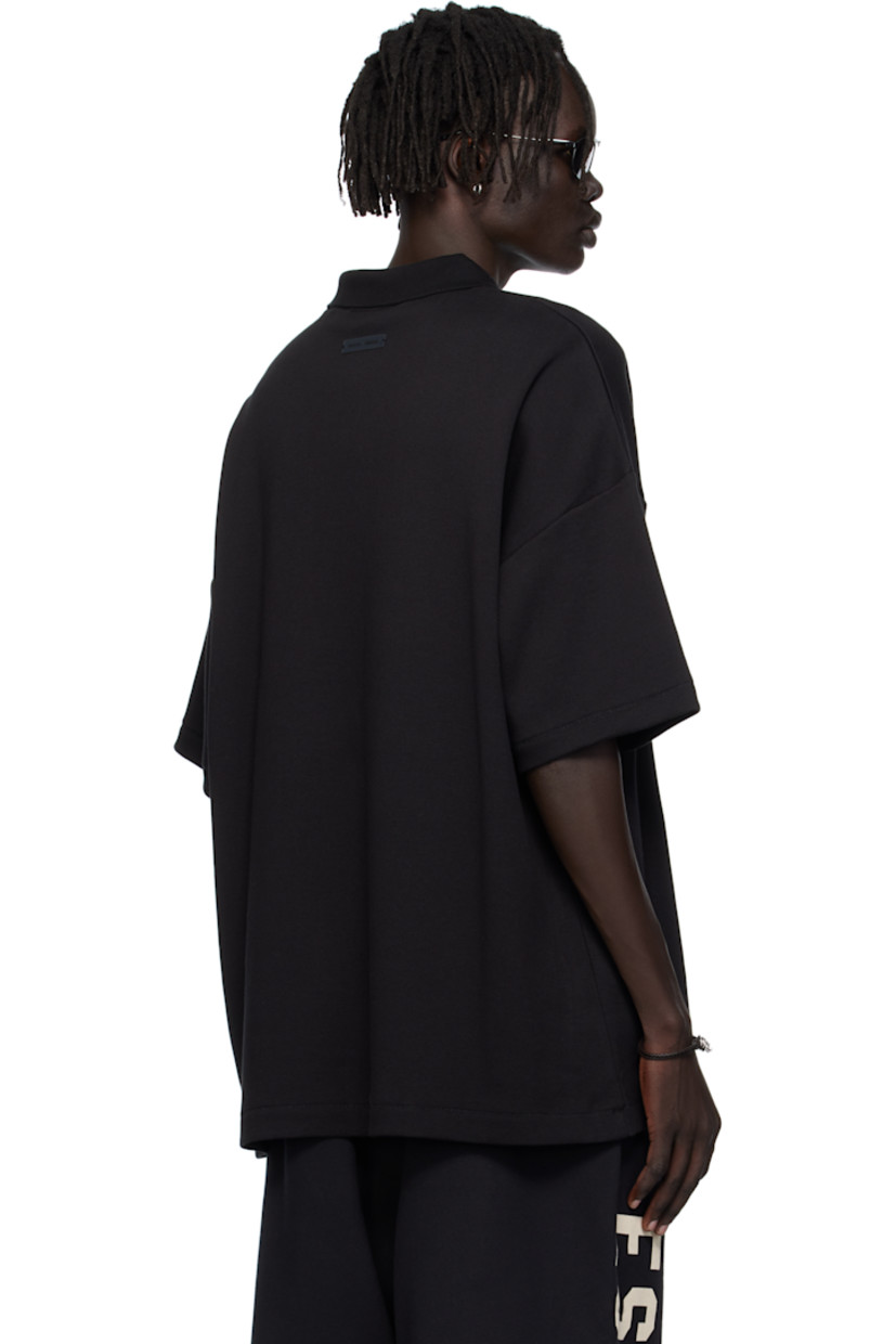 Cotton-blend piqué polo.

· Rib-knit spread collar
· Rubber logo patch at chest and back
· Dropped shoulders

Supplier color: Jet black