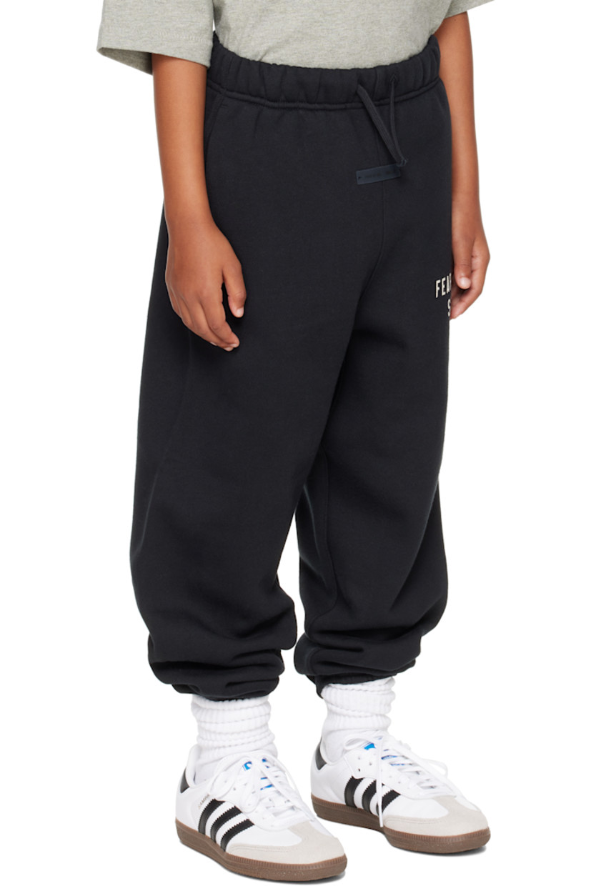 Cotton-blend fleece sweatpants.

· Drawstring at elasticized waistband
· Two-pocket styling
· Rubber logo patch at front
· Logo printed at leg
· Elasticized cuffs
· Rib-knit gusset at inseam

Supplier color: Jet black

Model measures 49" / 124.5 cm tall and wears size 8Y.

Size: child's height 
2/3Y: 36-41" / 91.5-104 cm 
4/5Y: 41-44.5" / 104-113 cm 
6/7Y: 44.5-48.5" / 113-123 cm 
8Y: 48.5-53" / 123-134.5 cm 
10Y: 53-58" / 134.5-147.5 cm 
12Y: 58-62" / 147.3-157.5 cm 
14/16Y: 63-67" / 157.5-170.2 cm