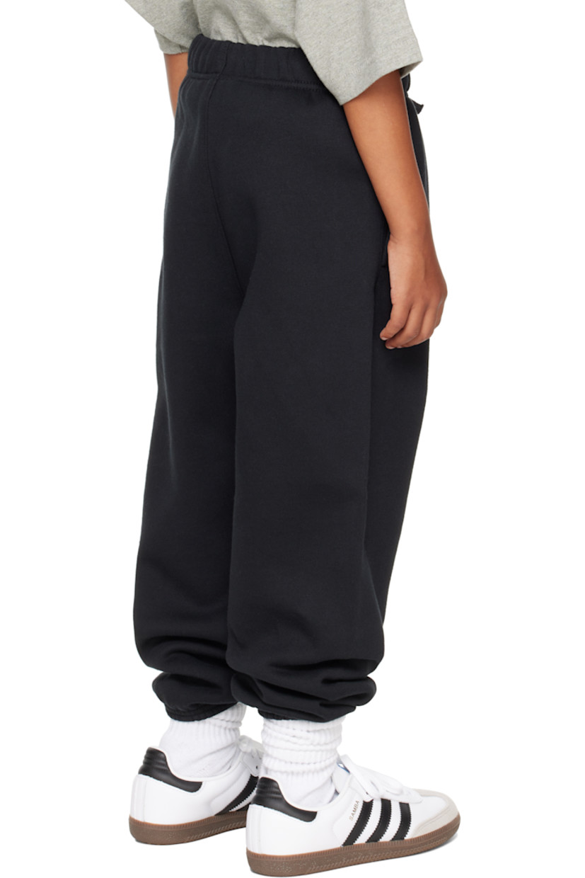 Cotton-blend fleece sweatpants.

· Drawstring at elasticized waistband
· Two-pocket styling
· Rubber logo patch at front
· Logo printed at leg
· Elasticized cuffs
· Rib-knit gusset at inseam

Supplier color: Jet black

Model measures 49" / 124.5 cm tall and wears size 8Y.

Size: child's height 
2/3Y: 36-41" / 91.5-104 cm 
4/5Y: 41-44.5" / 104-113 cm 
6/7Y: 44.5-48.5" / 113-123 cm 
8Y: 48.5-53" / 123-134.5 cm 
10Y: 53-58" / 134.5-147.5 cm 
12Y: 58-62" / 147.3-157.5 cm 
14/16Y: 63-67" / 157.5-170.2 cm