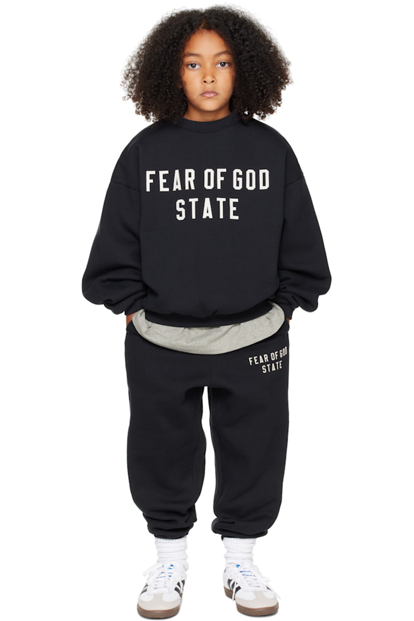 Cotton-blend fleece sweatpants.

· Drawstring at elasticized waistband
· Two-pocket styling
· Rubber logo patch at front
· Logo printed at leg
· Elasticized cuffs
· Rib-knit gusset at inseam

Supplier color: Jet black

Model measures 49" / 124.5 cm tall and wears size 8Y.

Size: child's height 
2/3Y: 36-41" / 91.5-104 cm 
4/5Y: 41-44.5" / 104-113 cm 
6/7Y: 44.5-48.5" / 113-123 cm 
8Y: 48.5-53" / 123-134.5 cm 
10Y: 53-58" / 134.5-147.5 cm 
12Y: 58-62" / 147.3-157.5 cm 
14/16Y: 63-67" / 157.5-170.2 cm