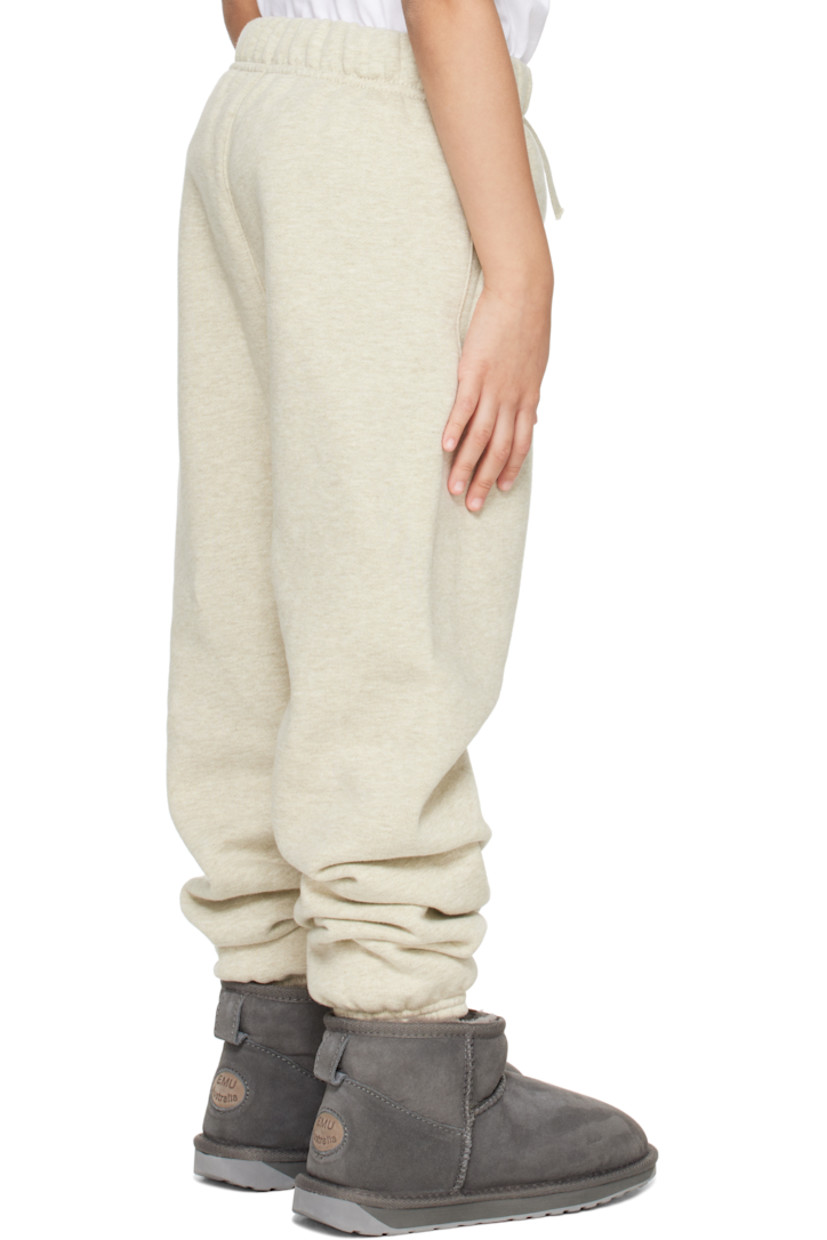380 gsm cotton-blend fleece sweatpants.

· Drawstring at elasticized waistband 
· Two-pocket styling
· Logo patch at front
· Logo bonded at front leg
· Elasticized cuffs
· Machine-wash

Supplier color: Heather stone

Model measures 46" / 116.8 cm tall and wears size 6/7Y.

Size: child's height 
2/3Y: 36-41" / 91.5-104 cm 
4/5Y: 41-44.5" / 104-113 cm 
6/7Y: 44.5-48.5" / 113-123 cm 
8Y: 48.5-53" / 123-134.5 cm 
10Y: 53-58" / 134.5-147.5 cm 
12Y: 58-62" / 147.3-157.5 cm 
14/16Y: 63-67" / 157.5-170.2 cm