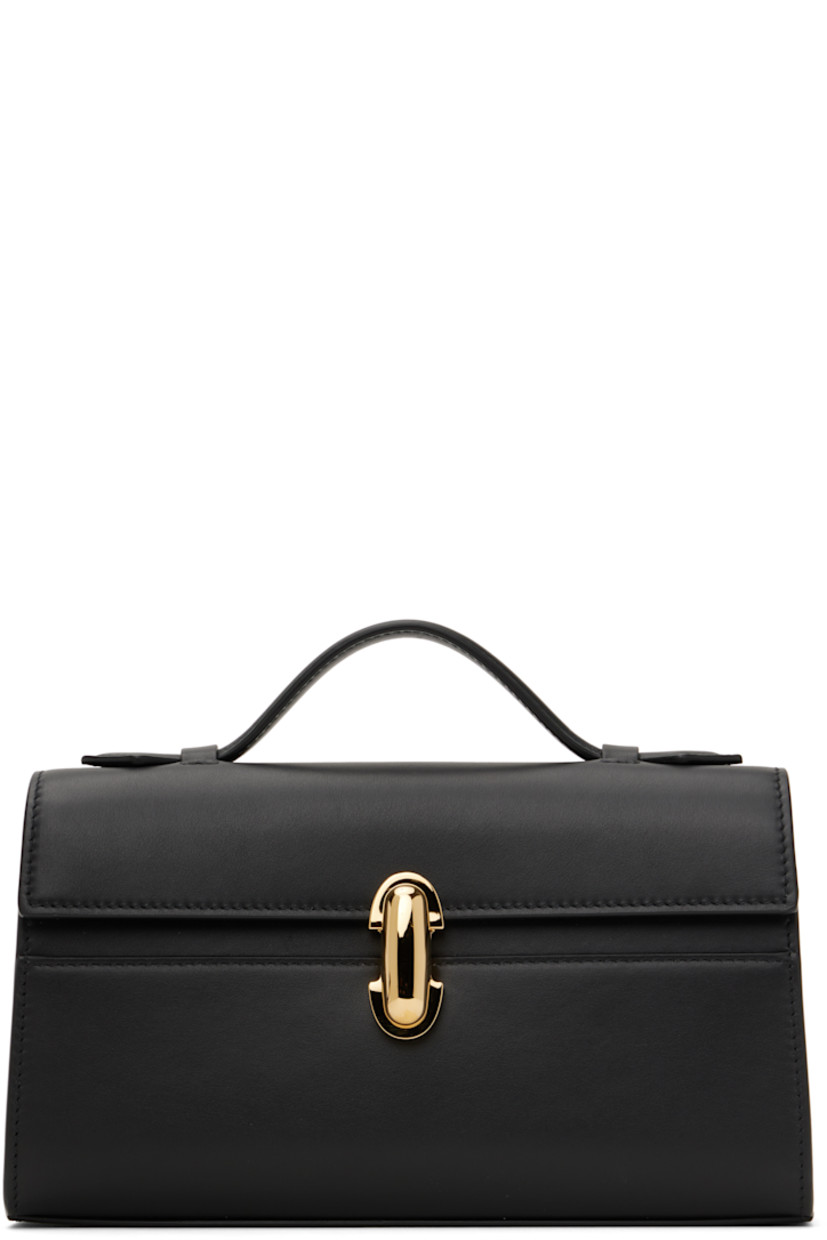 Buffed calfskin top handle bag in black.

· Fixed carry handle
· Turn-lock flap
· Card slot at interior
· Buffed calfskin lining
· Gold-tone hardware
· H5.5" x W8.5" x D3"

Supplier color: Black leather