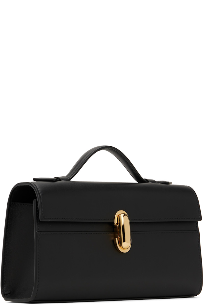 Buffed calfskin top handle bag in black.

· Fixed carry handle
· Turn-lock flap
· Card slot at interior
· Buffed calfskin lining
· Gold-tone hardware
· H5.5" x W8.5" x D3"

Supplier color: Black leather