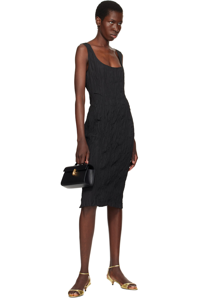 Buffed calfskin top handle bag in black.

· Fixed carry handle
· Turn-lock flap
· Card slot at interior
· Buffed calfskin lining
· Gold-tone hardware
· H5.5" x W8.5" x D3"

Supplier color: Black leather