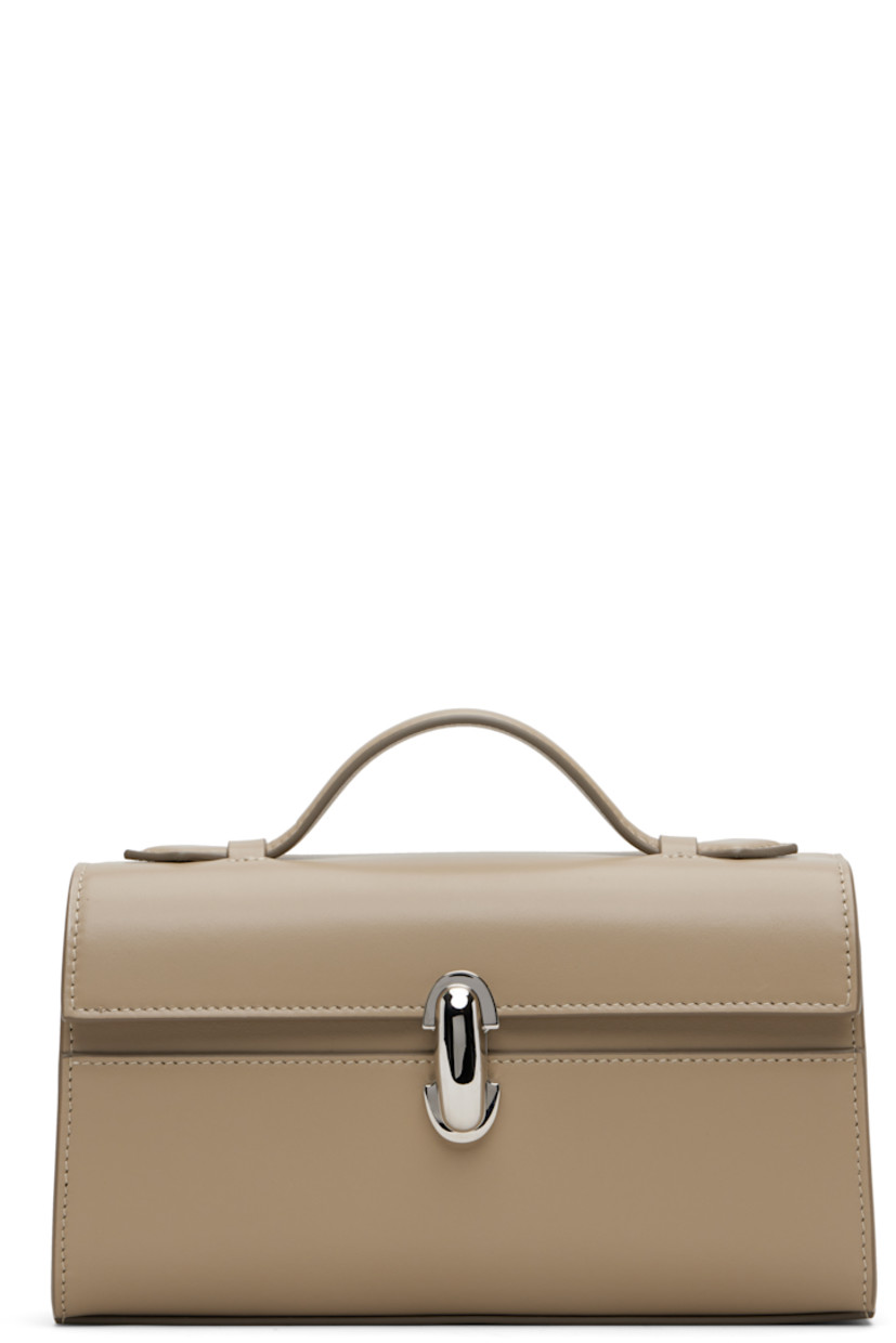 Rigid buffed calfskin top handle bag.

· Collapsible carry handle
· Foldover flap with turn-lock clasp
· Patch pocket at interior
· Leather lining
· H5" x W8.5" x D3"

Supplier color: Clay