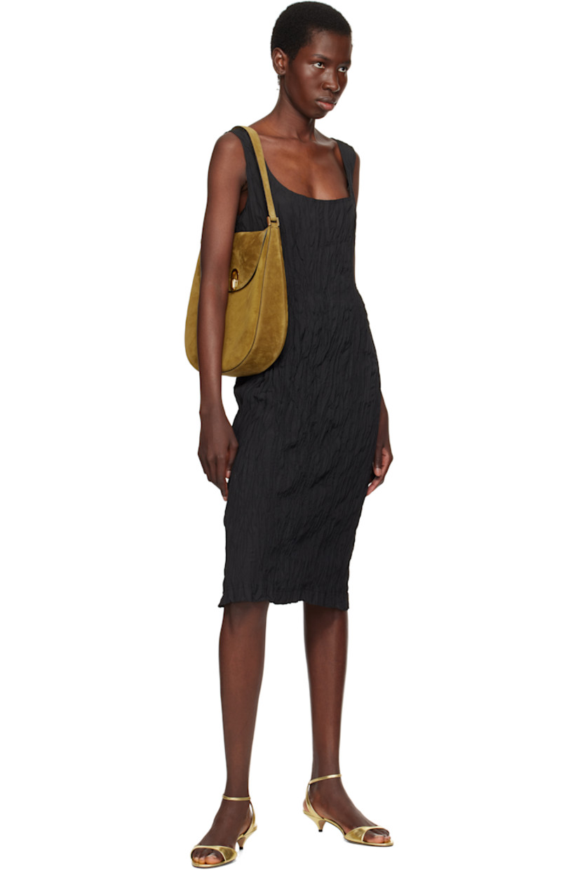 Calfskin suede shoulder bag in brown.

· Adjustable shoulder strap
· Magnetic tab-slot closure
· Patch pocket at interior
· Suede lining
· Gold-tone hardware
· H12" x W11.5" x D3"

Supplier color: Sepia