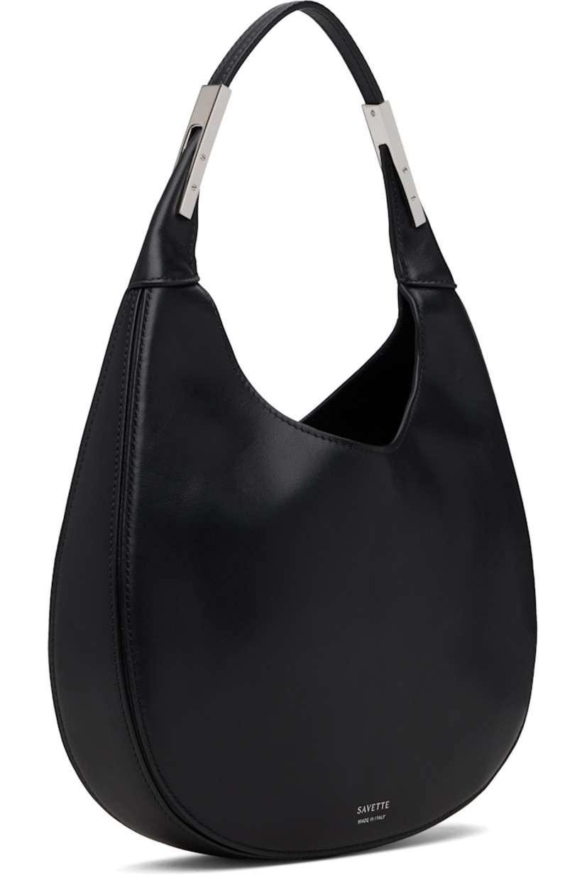 Grained calfskin shoulder bag. 

· Integrated shoulder strap with hardware
· Logo stamp at back face
· Self-tie closure at throat
· Suede lining
· H8" x W9.5" x D2"
· Total height: H13"

Supplier color: Black