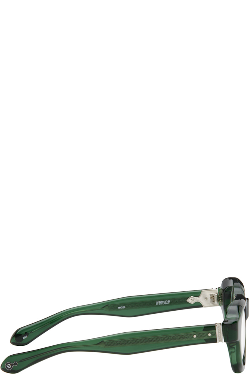 Handcrafted semi-transparent acetate-frame optical glasses in green. 

· Integrated nose pads
· Filigree detailing at exposed core wires
· Silver-tone hardware
· Includes case
· Size: 47.25 145

Supplier color: Bottle green
