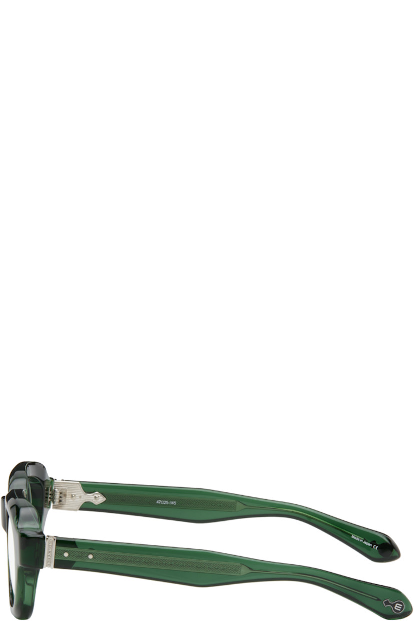 Handcrafted semi-transparent acetate-frame optical glasses in green. 

· Integrated nose pads
· Filigree detailing at exposed core wires
· Silver-tone hardware
· Includes case
· Size: 47.25 145

Supplier color: Bottle green