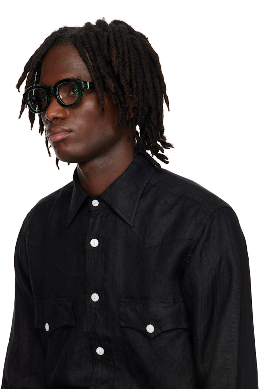 Handcrafted semi-transparent acetate-frame optical glasses in green. 

· Integrated nose pads
· Filigree detailing at exposed core wires
· Silver-tone hardware
· Includes case
· Size: 47.25 145

Supplier color: Bottle green