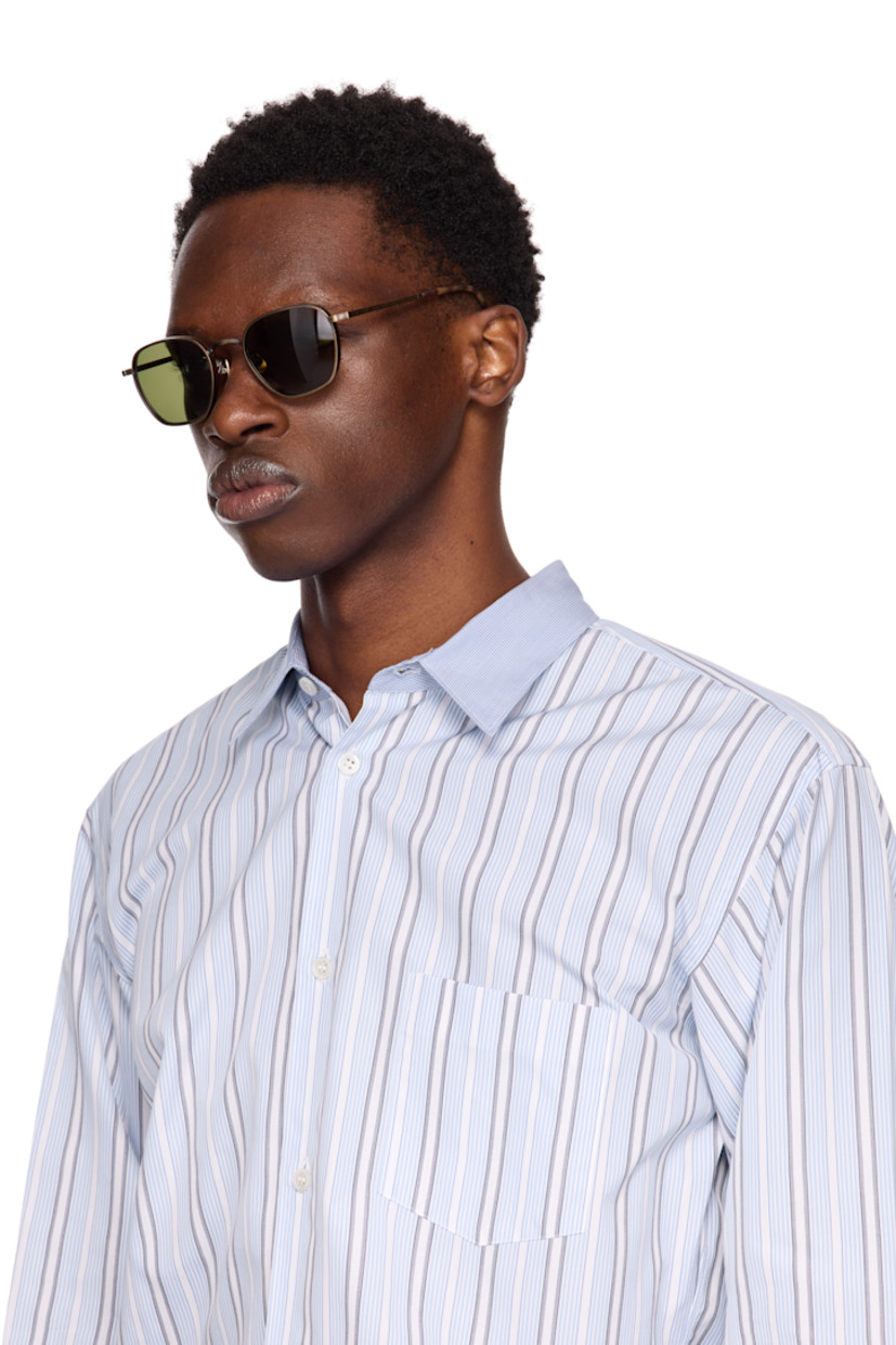 Hexagonal titanium-frame sunglasses in antiqued gold tone. Hand-lacquered detailing, logo pattern, and engraved detailing throughout.

· Lightweight
· Green lenses
· 100% UVA/UVB protection 
· Adjustable titanium nose pads
· Tortoiseshell acetate temple tips
· Includes case
· Size: 52.21 145

Supplier color: Antique gold/Dark brown