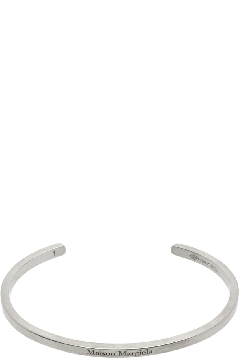 Open cuff bracelet in antiqued sterling silver. Logo engraved at face.

Supplier color: Palladio buratta