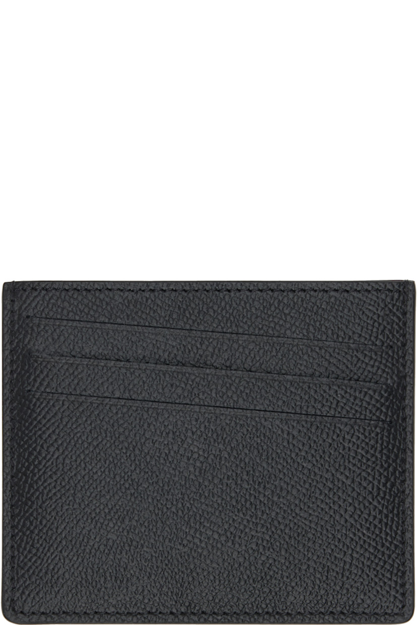 Saffiano and buffed calfskin card holder.

· Five card slots
· Central note slot 
· White stitching at back face 
· Canvas lining 
· H3.25" x W4"

Supplier color: Black