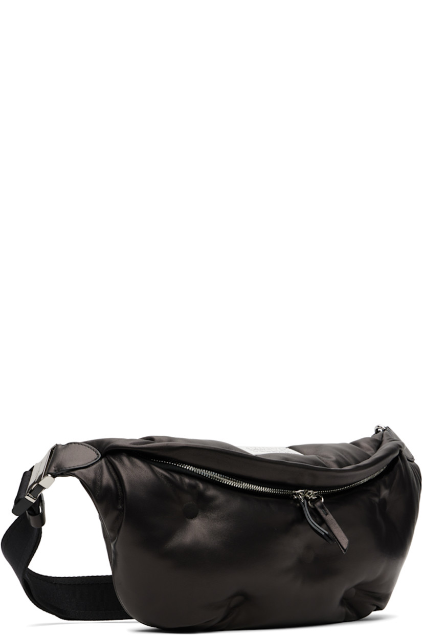 Grained sheepskin belt bag.

· Adjustable crossbody strap with buckle
· Logo patch and white stitching at top
· Tufting at face
· Zip compartment at back face
· Zip closure at main compartment
· Zip pocket at interior
· Satin lining
· H7" x W16" x D4.5"

Supplier color: Black