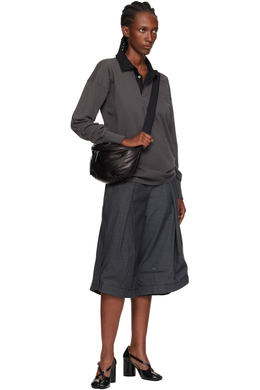 Grained sheepskin belt bag.

· Adjustable crossbody strap with buckle
· Logo patch and white stitching at top
· Tufting at face
· Zip compartment at back face
· Zip closure at main compartment
· Zip pocket at interior
· Satin lining
· H7" x W16" x D4.5"

Supplier color: Black