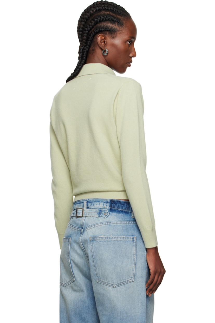 Knit virgin wool polo.

· Rib-knit open spread collar, hem, and cuffs
· White stitching at back collar

Supplier color: Pale green