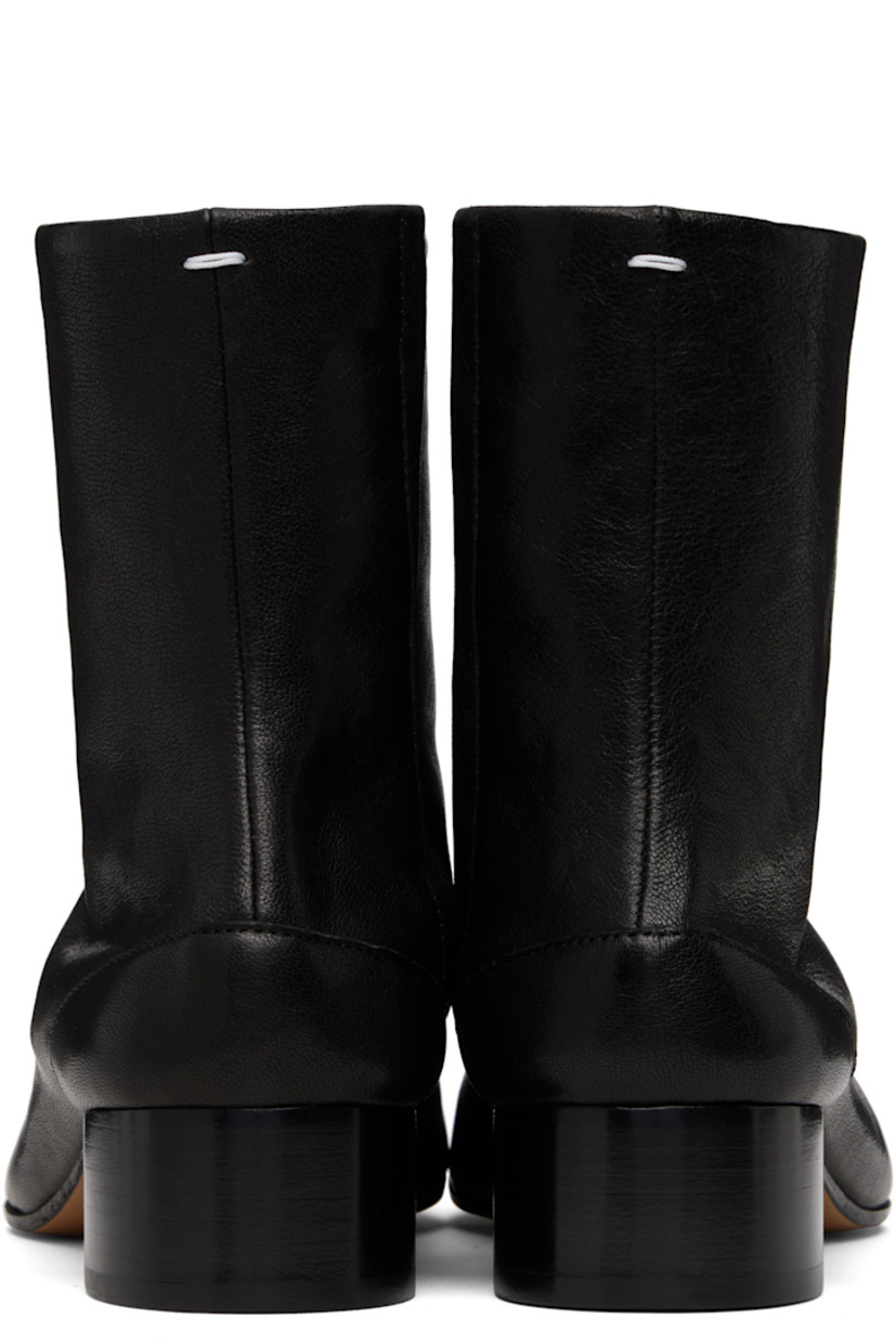 Ankle-high buffed lambskin boots.

· Square cleft toe
· Hook-eye closure at inner side
· White stitching at heel collar
· Stacked cylindrical heel with rubber injection
· Calfskin sole
· Heel: H1.25"

Supplier color: Black